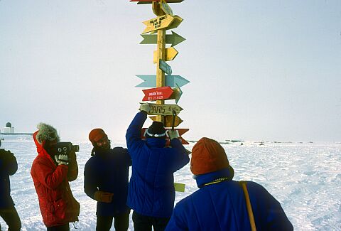 [Cappelle137.jpg]
Official ceremony: Martine nails down the PARIS sign on the South Pole pole in the presence of a russian winterer (image © Thierry Cappelle 1977, used with permission).