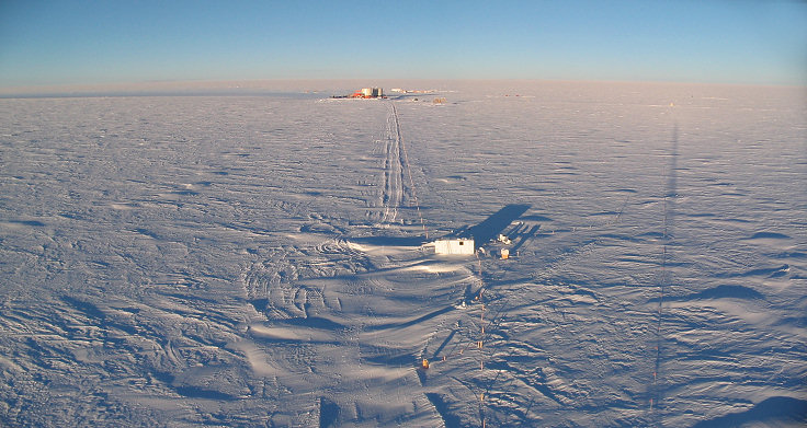 [20050408_10_Road.jpg]
Concordia and the atmospheric science shelter seen from the summit of the American mast. Notice the trail of smoke running north very close to the ground. The shadow of the tower is over the limit of the clean area and points towards my CR23 mast (little green pixel).