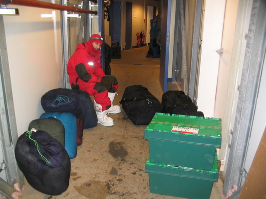 [20050427_17_ContingencyGear.jpg]
Karim taking a break while carrying the contingency equipment to the container.