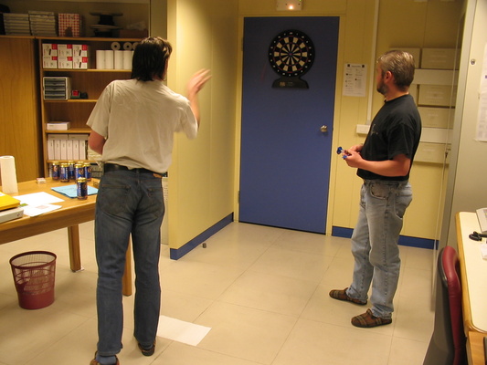 [20050731_008_Darts.jpg]
Stef throwing darts on the door of the radio room, with Jean watching.