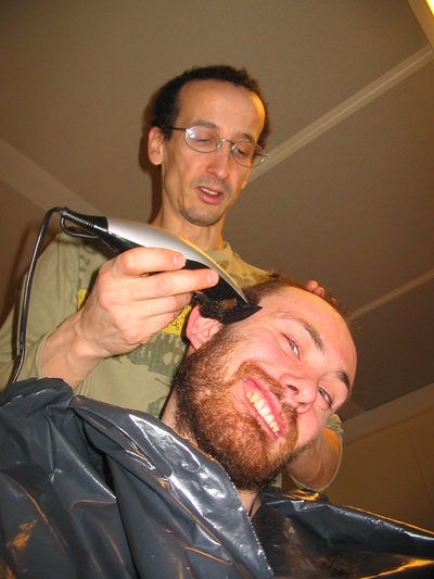 [20051001_014_HaircutEmanuele.jpg]
Karim, our official 'hairdresser', giving a close shave to a willing Emanuele