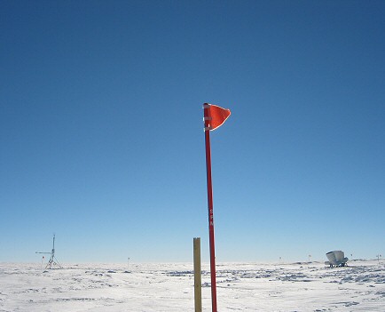 [Backscatter.jpg]
This is the view that makes astronomers drool about Dome C. In early afternoon the light from the backlit sun hidden behind the flag is not scattered at all: no humidity in the atmosphere, no ice crystals. In other words, excellent viewing conditions, you can even see stars in the middle of the day. Also visible are our instruments: the Meteoflux (left) and Sodar (right).