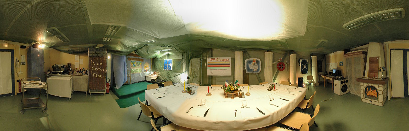 [DSC_MidwinterPano.jpg]
And here is the result, a 360° panorama of the room decorated for the midwinter, before the party starts. From left to right, starting from the door: the bar 'A la cervoise tiède', the stage, the fountain in the corner, the points checklist, the set table, the stereo and the fireplace.