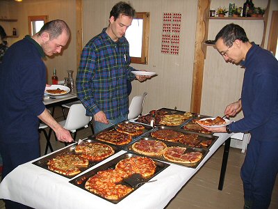 [LastSummerCampDinner.jpg]
Last lunch at the summer camp: Emanuele, Pascal and Karim choosing their slices of fresh pizza.