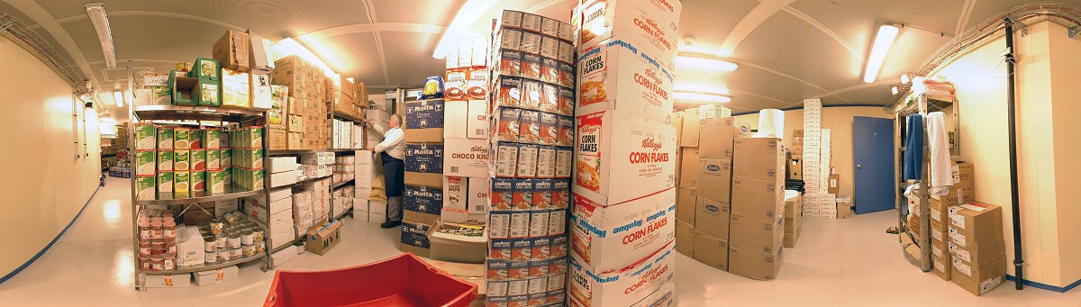 [PanoStorage.jpg]
Jean-Louis picking items in the 'dry' food storage room (the wine is at the very end). There are two additional storage rooms on the same floor: the 4°C room where perishables are stored and the future freezer room, not yet built that's why we simply keep frozen products outside the station in simple containers.