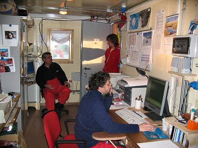 [RadioRoom.jpg]
The operating room and communication center of the summer camp and two of its operators: Sergio (from whom I've borrowed many photographs you see here) and Sandro. Only Rita is missing but you can see her small photograph on the closet !.