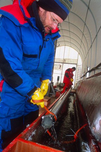 [SJ_GlacioLaurentKeroseneBath.jpg]
Putting the drill in a kerosene bath to warm it up without melting it.