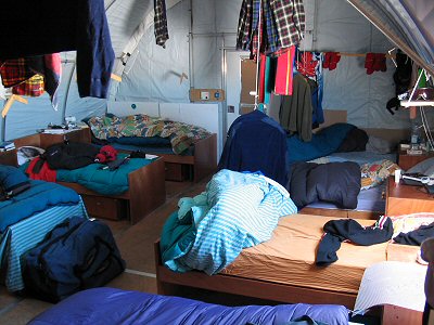[TentRoom.jpg]
One of the empty sleeping tents during the day. My bed is the 2nd on the left. 8 people sleep there in summer and there are 5 such tents plus some other accommodations.