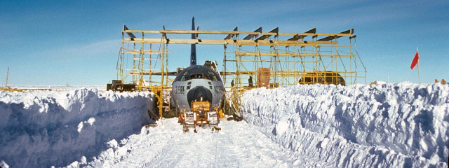 [Dome_Charlie_Slide18_.jpg]
The trench. Although it snows only about 5cm every year at Dome C, heavy and dark objects tend to dig themselves in the snow much quicker. Add to this enough wind to form spindrifts and after just a year half of a plane is under packed snow you wouldn't want to shovel out (image courtesy Richard Sheehan)