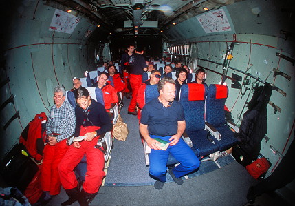 [C130PassengersFEW.jpg]
Passengers on board of a 'civilian C130'. Other flights are done on board of military airplanes and are much less comfortable (no seats).
