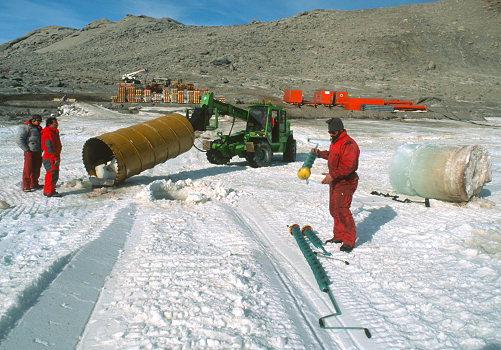 [SeaIceDrill.jpg]
Drilling the sea ice with heavy methods. This is used to analyze to algae growing on the bottom of the ice, and also provides hole well appreciated by the seals. 2nd from left is the late Mario Zuchelli, instigator and head of the Italian Antarctic Project.