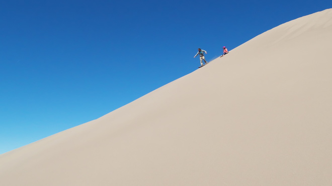 [20190503_100630_SandDunes.jpg]
Synchronized sandboarding and sliding. Yup, the sky color is for real.