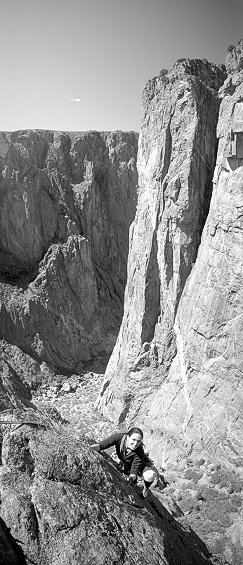 [MaidenVoyage_VPano.jpg]
Jenny on the 4th pitch of Maiden Voyage, with a view on the North Chasm View Wall. The Scenic Cruise follows the left side of the pillar. The large dihedral of the second pitch is visible near the base. Yes, that little thing is the entire 2nd pitch...