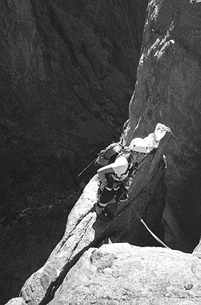 [SC_FlakeP9.jpg]
Jenny standing on the flake of the short 9th pitch, after an awkward squeeze and before a committing layback.