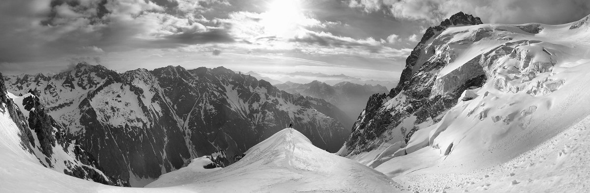 [20060505_ViolettesSeracsPano_BW.jpg]
A panoramic view of a critical section of the descent, still on the left of the Violettes glacier. If there's enough snow, you can ski on the right of the bump, right onto the glacier. Otherwise you have to go left for a rappel or a bit of downclimbing like we had to do. On the right, the narrow couloir between the hanging seracs (right) and the rock ridge (left) is the classic Chaux gully.