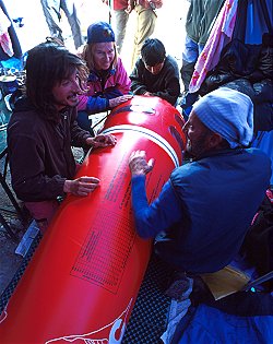 [PressureTank.jpg]
Tonino, suffering from a cold, is put into the pressure tank for the afternoon so he can rest better. One has to keep pumping to send him fresh air and a pressure valve ensures that the inside altitude reaches about 3500m instead of the high 5700m of Base Camp. He also spent some time writing a diary (in Italian ).