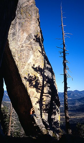 [TouchingBoulder.jpg]
There are plenty of very interesting looking routes on Sundance, and some interesting features as well, such as this big laying boulder...