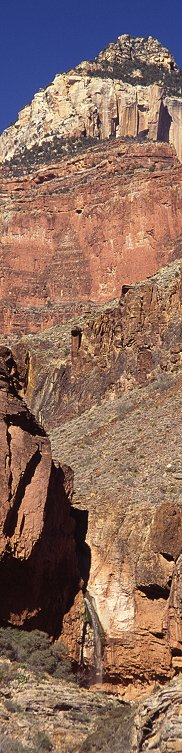 [RibbonFallsFar.jpg]
This is simply a vertical picture of Ribbon Falls, on the north Kaibab Trail of Grand Canyon, cropped into a panorama. Notice that the cropping induces a drop in sharpness compared to assembled panoramas.