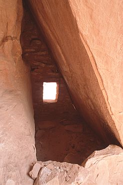 [BoulderHouse.jpg]
Small house under a flat boulder.