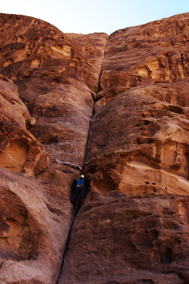 [20111104_090555_MerlinsWand.jpg]
That'd be me leading the way up the perfect crack of Merlin's Wand. Never very hard but still quite sustained. Most of the classic routes of Wadi Rum are in the 5/6a range, a more moderate level than Utah.