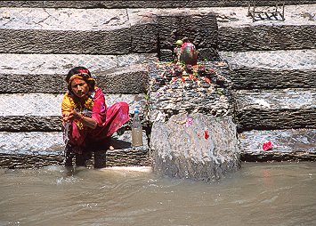 [Ablutions.jpg]
A pilgrim doing her ablutions in the river at Pashupatinah.