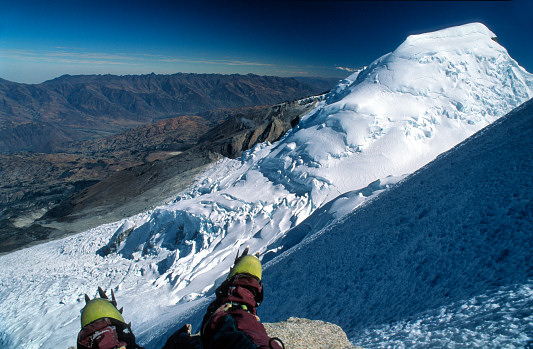 [Escudo.jpg]
Peru, my second expedition and time of my biggest mountain solos. After we took turns being sick at various base camps, I felt like a lion soloing a vertical km of 60° ice in a few hours. On top a lone rock offers the first rest of the last 2 hours of repetitive hammering. And an impressive sight.