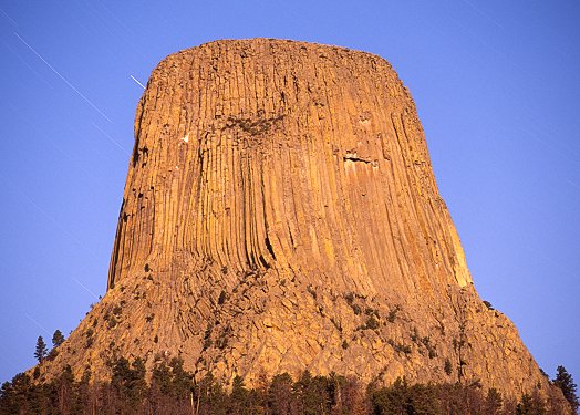 [DevilTowerMoonLight.jpg]
Devil's Tower seen by the light of the full moon. The headlamps of a descending party are visible on the left.