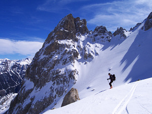 Skiing dow from the Tete d'Amont, with the famous rock of the Tenaille de Montbrison behind
