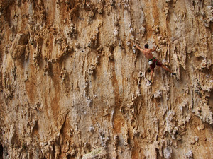 Vincent on DNA (7b), navigating the incredible stalactites coming down the roof of the Grande Grotta