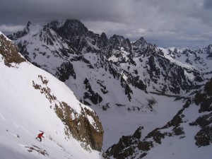 Skiing down the steep Glacier Noir pass couloir