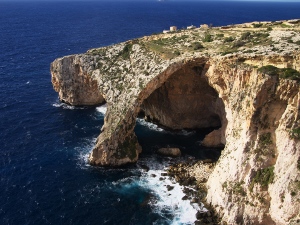 The Blue Grotto arch above the sea