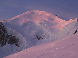 Sunrise on Mt Blanc as seen from the summit of the Gouter Dome. We'll ski that face right down the middle later on
