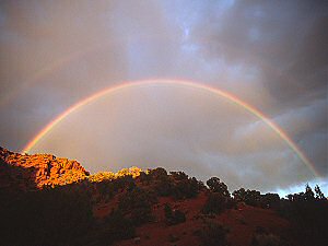 Full double rainbow in the sunset