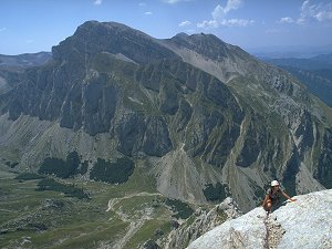 Jenny summiting the Seconda Spalla with Mt Intermesoli in the back, Gran Sasso