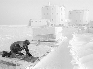 Jean working on fixing a sled in the spring fog