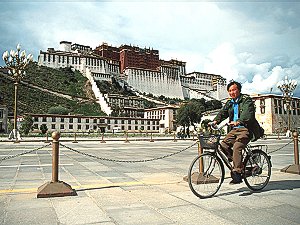 A chinese biker below the Potala, Lhasa