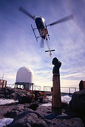 DdU003 - Helicopter flying above the statue of Paul-Emile Victor