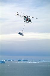 DdU_IcebergsHelico - Helicopter above the Antarctic Ocean.