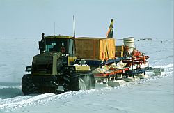 DomeC_TraverseLeaving - Caterpilar 'Traverse Special' carrying scientific equipment near Dome C, Antarctique