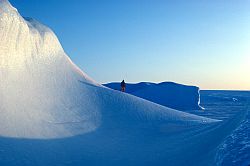 IcebergWalker - Explorer standing on iceberg, Antarctica