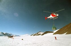 TNB_Helicopter - Helicopter carrying equipment before Twin Otter transfer to Dome C 1998
