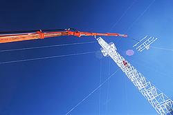 AmericanMastBlueSky2 - Working on a mast with blue sky.