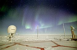 AuroraRoofLow01 - Green and purple aurora in the Antarctic night.