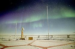 AuroraRoofLow09 - Green and purple aurora in the Antarctic night.