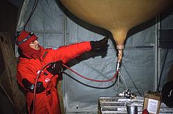 BalloonLaunch5 - Inflating a helium balloon before the lauche of a radiosonde.