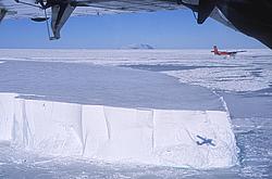 FlyingAboveIceberg - Twin Otter flying above a 'small' tabular iceberg.
[ Click to download the free wallpaper version of this image ]