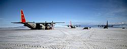 LandingFieldC130a - C130s parked on the McMurdo airstrip. There can be as many as 10 of those, ferrying people and equipment back and forth between Christchurch (NZ), McMurdo, South Pole and, rarely, other Antarctic stations. Even foreign nations like Italy land their (rented) C-130s at McMurdo before continuing the trip in Twin-Otter or helicopters.
[ Click to go to the page where that image comes from ]