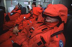 SleepingOnC130 - Passengers sleeping during the long flight back from Antarctica. The noise level on board the aircraft is so high, it precludes any conversation. You either read or sleep. Or watch out the window in first hour of the flight if you are fortunate enough to have a window seat.
[ Click to go to the page where that image comes from ]