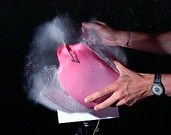 [BalloonCondensation.jpg]
Bursting a balloon with a sound trigger connected to the flash. The humidity contained inside suddenly condenses when the hot humid air inside suffers a sudden pressure drops.