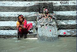 Ablutions - Pilgrim doing abblutions in the Gange, Nepal 2000
[ Click to go to the page where that image comes from ]